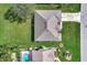 Aerial view of home with meticulously maintained lawn and landscaping at 26052 Salonika Ln, Punta Gorda, FL 33983
