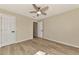 A serene bedroom with neutral paint, wood floors, and a modern ceiling fan at 26052 Salonika Ln, Punta Gorda, FL 33983
