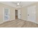 Bedroom with hardwood flooring with multiple doors for closet and exterior access at 26052 Salonika Ln, Punta Gorda, FL 33983