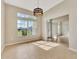 Bright dining room with large windows providing lots of natural light and tiled floor at 26052 Salonika Ln, Punta Gorda, FL 33983