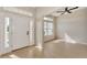 Bright foyer with tile flooring, white front door, and natural light at 26052 Salonika Ln, Punta Gorda, FL 33983