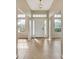 Bright foyer with tile flooring and natural light streaming through the windows at 26052 Salonika Ln, Punta Gorda, FL 33983