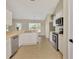 Updated kitchen with stainless steel appliances and breakfast bar seamlessly connects to the dining area at 26052 Salonika Ln, Punta Gorda, FL 33983