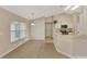 Bright eat-in kitchen features tile flooring and white cabinets, perfect for casual dining at 26052 Salonika Ln, Punta Gorda, FL 33983