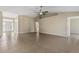 Large living room featuring an open floor plan with tile flooring and high ceilings at 26052 Salonika Ln, Punta Gorda, FL 33983