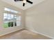 A simple room with tile flooring, neutral paint, base trim and natural light at 26052 Salonika Ln, Punta Gorda, FL 33983