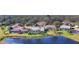 An aerial view of the houses and backyard pond at 3445 Highlands Bridge Rd, Sarasota, FL 34235