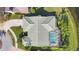Aerial view of the property showing pool, landscaped yard, and driveway at 3445 Highlands Bridge Rd, Sarasota, FL 34235