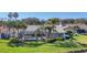 Beautiful home featuring an enclosed pool and lush landscaping in the backyard at 3445 Highlands Bridge Rd, Sarasota, FL 34235