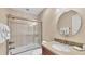 Bathroom featuring a tiled shower, vanity, and a granite countertop sink at 3445 Highlands Bridge Rd, Sarasota, FL 34235