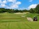 Scenic golf course view with sand traps and lush green fairways, promising an enjoyable golfing experience at 3445 Highlands Bridge Rd, Sarasota, FL 34235