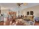 Spacious living room with hardwood floors and a view into the gourmet kitchen at 3445 Highlands Bridge Rd, Sarasota, FL 34235