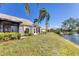 Well-maintained backyard overlooking a tranquil pond and community landscaping at 3522 57Th Avenue W Cir, Bradenton, FL 34210