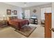 Relaxing bedroom with plush carpeting, ceiling fan, and bright natural light at 3522 57Th Avenue W Cir, Bradenton, FL 34210