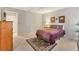 Calm bedroom with a bed, ensuite bathroom and a decorative rug at 3522 57Th Avenue W Cir, Bradenton, FL 34210