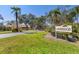 Welcome to Lakebridge! A beautiful view of the community entrance, lush landscaping, and an inviting atmosphere at 3522 57Th Avenue W Cir, Bradenton, FL 34210