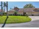 Inviting villa showcasing manicured lawn and landscaping, complemented by a private driveway and charming exterior details at 3522 57Th Avenue W Cir, Bradenton, FL 34210