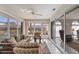 Light-filled Florida room with comfortable seating and pond view for relaxation and enjoyment at 3522 57Th Avenue W Cir, Bradenton, FL 34210