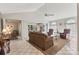 Cozy living room with neutral colors, a ceiling fan, and access to the screened-in porch at 3522 57Th Avenue W Cir, Bradenton, FL 34210