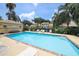 Sparkling community pool surrounded by comfortable lounge chairs and lush greenery, perfect for relaxation and recreation at 3522 57Th Avenue W Cir, Bradenton, FL 34210