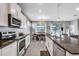 Bright kitchen with stainless steel appliances, granite countertops and an adjacent dining area at 4034 Mossy Limb Ct, Palmetto, FL 34221