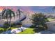 Beautiful house with lush landscaping and manicured lawn at 4060 Penshurst Park, Sarasota, FL 34235