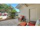 Cozy outdoor patio area with comfortable seating and serene garden views at 4060 Penshurst Park, Sarasota, FL 34235