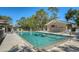 Community pool featuring lounge chairs and well-maintained surrounding area at 4060 Penshurst Park, Sarasota, FL 34235