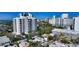 Stunning aerial view of a neighborhood featuring a high-rise condo with bay views at 422 Burns Ct, Sarasota, FL 34236