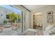 Bright bedroom with access to a private patio, featuring modern decor and a built-in closet space at 422 Burns Ct, Sarasota, FL 34236