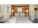 Cozy bedroom featuring a wood accent wall, stylish nightstands, and calming decor at 422 Burns Ct, Sarasota, FL 34236