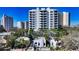 A neighborhood featuring luxury high-rise condos and charming stucco bungalows at 422 Burns Ct, Sarasota, FL 34236