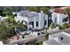 Stylish white stucco home with xeriscaping, low white walls, and a gated entryway at 422 Burns Ct, Sarasota, FL 34236