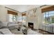 Bright and stylish living room with a cozy fireplace and comfortable white sofa at 422 Burns Ct, Sarasota, FL 34236