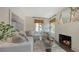 Bright and stylish living room with a cozy fireplace and comfortable white sofa at 422 Burns Ct, Sarasota, FL 34236