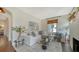 Bright living room featuring a plush white sofa, modern decor, and hardwood floors at 422 Burns Ct, Sarasota, FL 34236