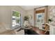 Bright living room features hardwood floors, stylish furnishings, and an inviting outdoor view at 422 Burns Ct, Sarasota, FL 34236