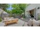 Inviting outdoor patio with stone floors, lounge seating, and a modern coffee table, perfect for entertaining at 422 Burns Ct, Sarasota, FL 34236