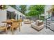 Expansive outdoor patio featuring dining and lounge areas, perfect for entertaining and relaxation at 422 Burns Ct, Sarasota, FL 34236