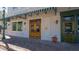 Inviting storefront with Rosemary & Thyme signage, wooden doors, and outdoor seating on a brick sidewalk at 422 Burns Ct, Sarasota, FL 34236