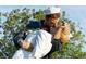 Close-up of the 'Unconditional Surrender' sculpture, portraying a sailor kissing a nurse at 422 Burns Ct, Sarasota, FL 34236