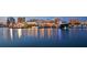 Beautiful view of illuminated city lights reflecting on a harbor with luxury yachts at 422 Burns Ct, Sarasota, FL 34236