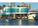 Scenic waterfront dining featuring a modern restaurant and docked yacht against cityscape at 422 Burns Ct, Sarasota, FL 34236