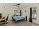 Bedroom with a ceiling fan, a desk area, and a bed at 5008 30Th Street E Ct, Bradenton, FL 34203