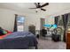 Bedroom with a ceiling fan, and a desk area at 5008 30Th Street E Ct, Bradenton, FL 34203
