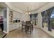 Cozy dining nook featuring tiled flooring, light-colored walls, and plentiful natural light at 5008 30Th Street E Ct, Bradenton, FL 34203
