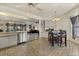Open concept kitchen with tile flooring seamlessly connects to the dining and living areas at 5008 30Th Street E Ct, Bradenton, FL 34203