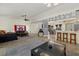 Spacious open-concept space connecting the living area, kitchen bar, and dining area for easy entertaining at 5008 30Th Street E Ct, Bradenton, FL 34203
