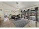 Bright living room with access to a screened pool area, neutral walls, and stylish tiled floors at 5008 30Th Street E Ct, Bradenton, FL 34203