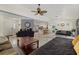 Spacious living room with a large window, ceiling fan, and open floor plan at 5008 30Th Street E Ct, Bradenton, FL 34203